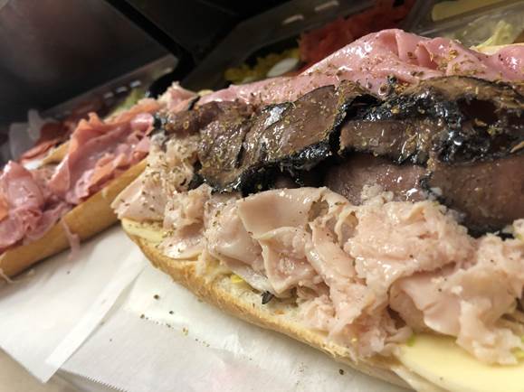 A close up of a sandwich on a plate

Description automatically generated