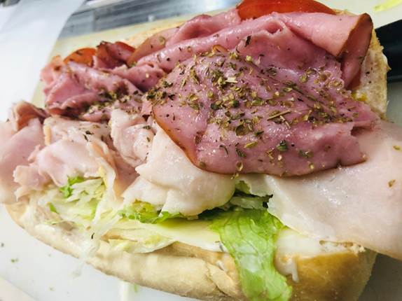 A close up of a sandwich on a plate

Description automatically generated